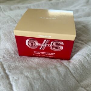 ONE/SIZE Ultimate Setting Powder in Translucent Red Box